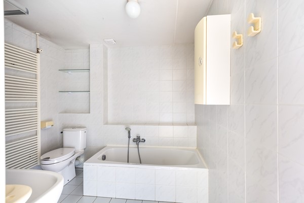 Foto - Te koop: tussenwoning gelegen aan groenvoorziening